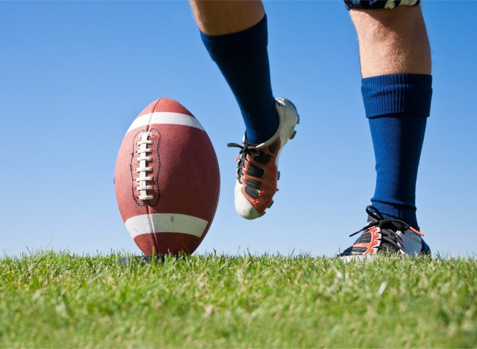 Man in cleats preparing to kick a football