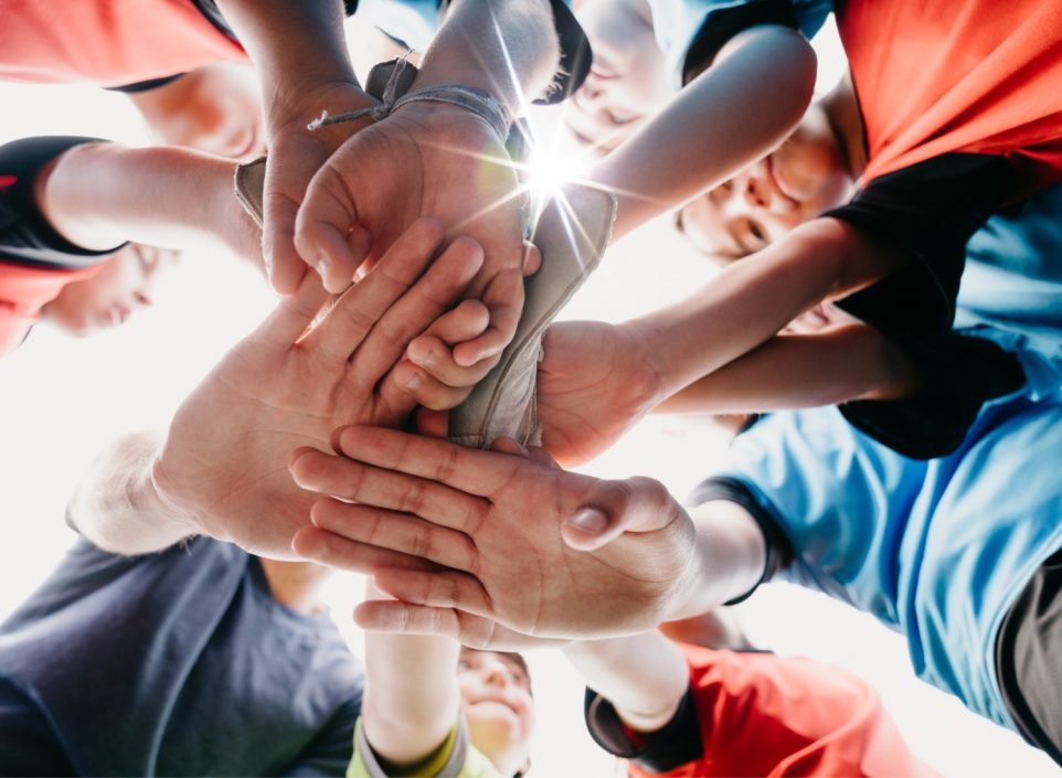 Children in football huddle