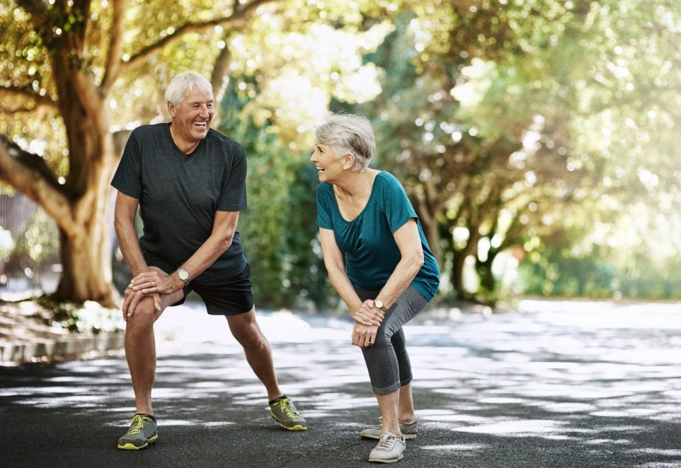 Shot of a senior couple warming up before a run outside