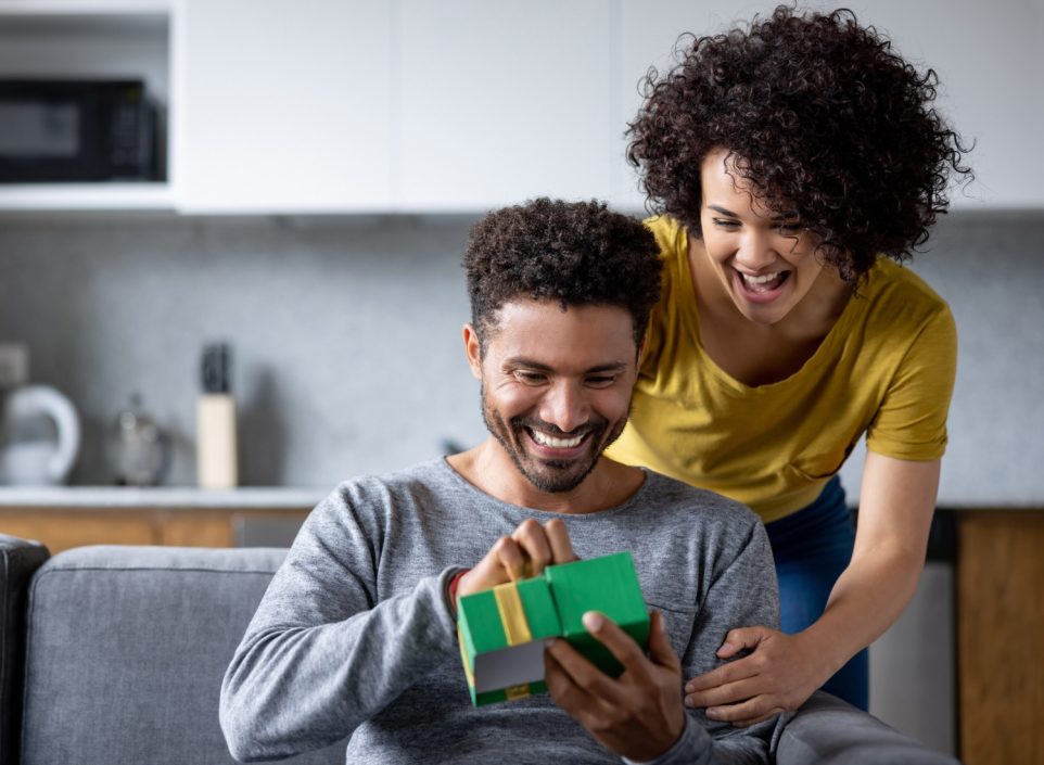 Woman giving a gift to a man